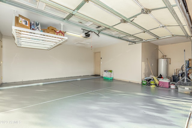 garage featuring a garage door opener and water heater