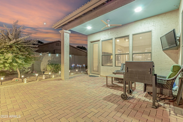 view of patio terrace at dusk