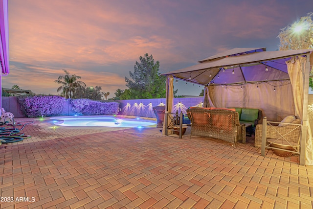 view of pool featuring a patio area, a fenced backyard, and a fenced in pool