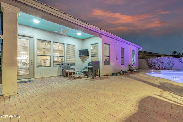 view of patio / terrace with a fenced in pool