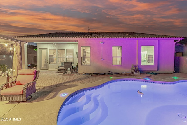 pool with a patio