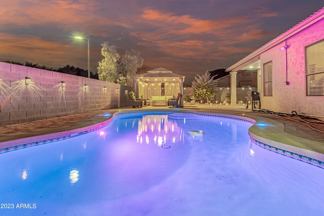 view of swimming pool with a patio area, a fenced backyard, and a fenced in pool