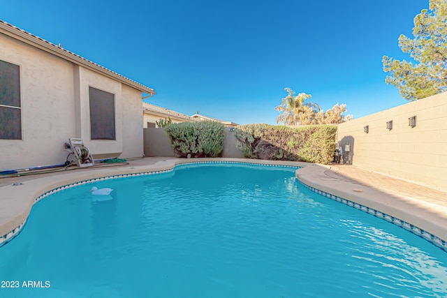 view of pool featuring a fenced in pool and a fenced backyard