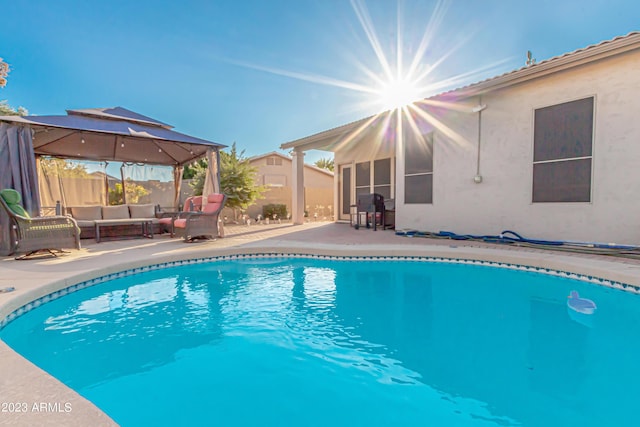 view of pool featuring a fenced in pool, an outdoor hangout area, fence, a gazebo, and a patio area