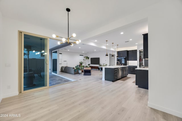 interior space with light hardwood / wood-style floors and a chandelier