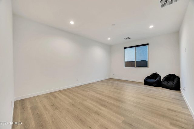 spare room with light wood-type flooring