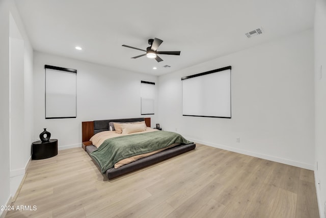 bedroom with ceiling fan and light wood-type flooring