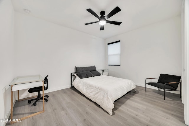 bedroom featuring ceiling fan and light hardwood / wood-style flooring