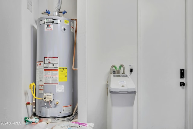 utility room featuring gas water heater