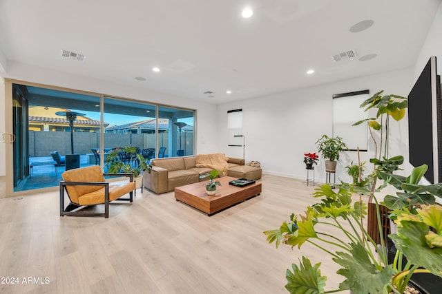 living room with light hardwood / wood-style floors