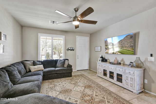 17626 W Paraiso Dr, Surprise, AZ 85387 - living area featuring light tile patterned flooring, ceiling fan, and baseboards
