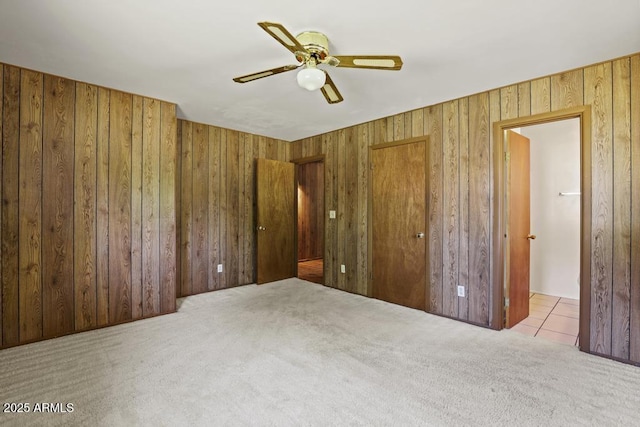 2137 N Flowing Springs Rd, Payson, AZ 85541 - carpeted bedroom with wood walls and a ceiling fan