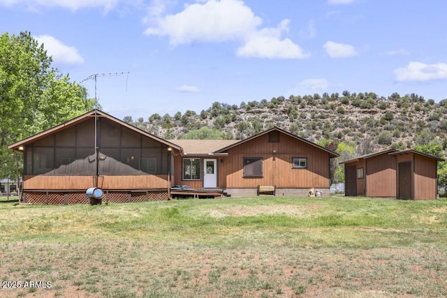 2137 N Flowing Springs Rd, Payson, AZ 85541 - rear view of property with a sunroom, a lawn, and a shed