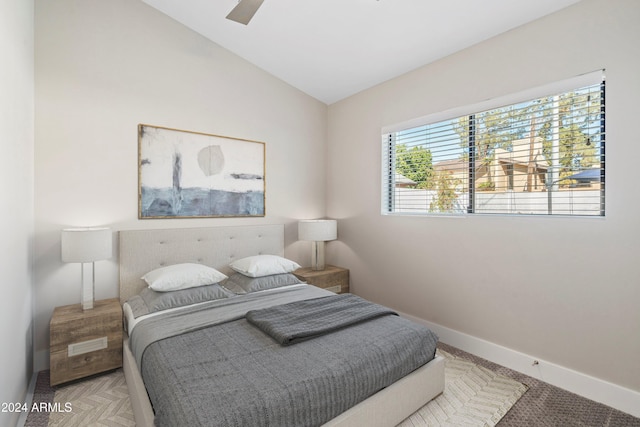 bedroom with ceiling fan and lofted ceiling