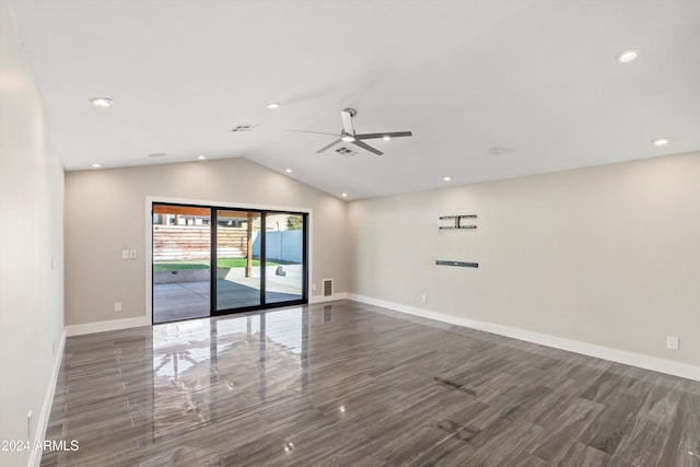 spare room featuring ceiling fan, dark hardwood / wood-style flooring, and lofted ceiling