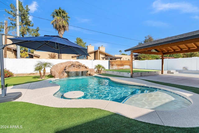 view of swimming pool with pool water feature, a gazebo, and a patio area