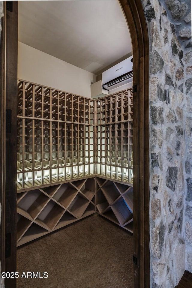 wine room with a wall mounted AC