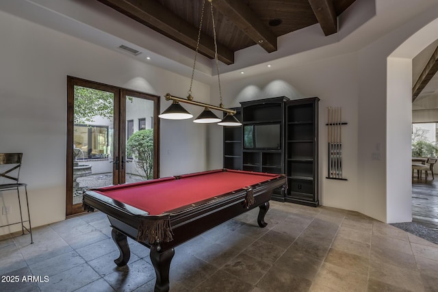 recreation room featuring beam ceiling, billiards, and french doors