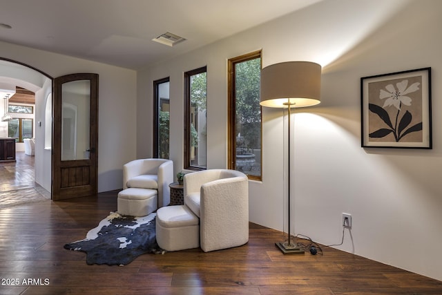 sitting room with dark hardwood / wood-style flooring