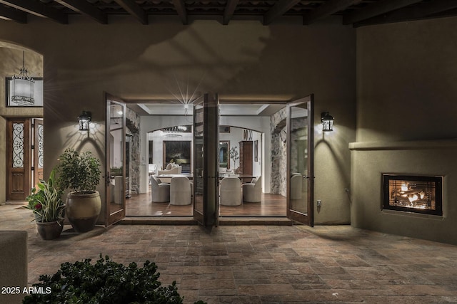 interior space with a fireplace and french doors