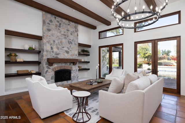 living room featuring dark wood-type flooring, beam ceiling, a high ceiling, a fireplace, and french doors