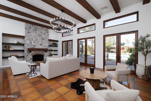 tiled living room with french doors, a stone fireplace, a high ceiling, and beamed ceiling