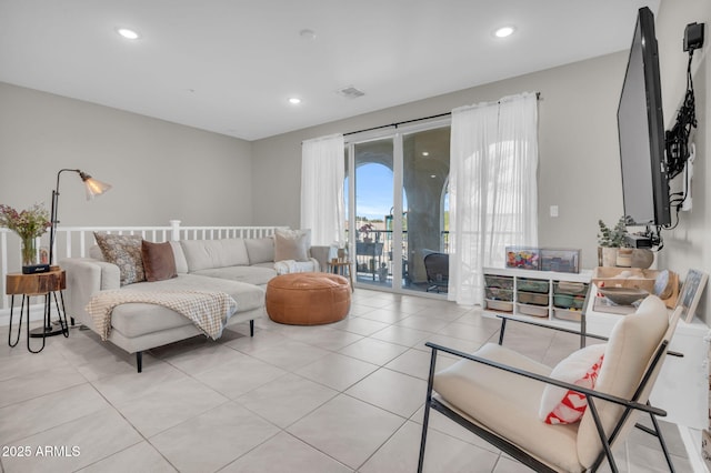 living room featuring recessed lighting, visible vents, and light tile patterned floors