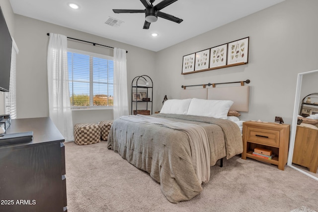 bedroom with light carpet, visible vents, a ceiling fan, and recessed lighting