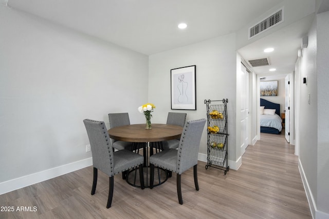 dining room featuring light hardwood / wood-style floors