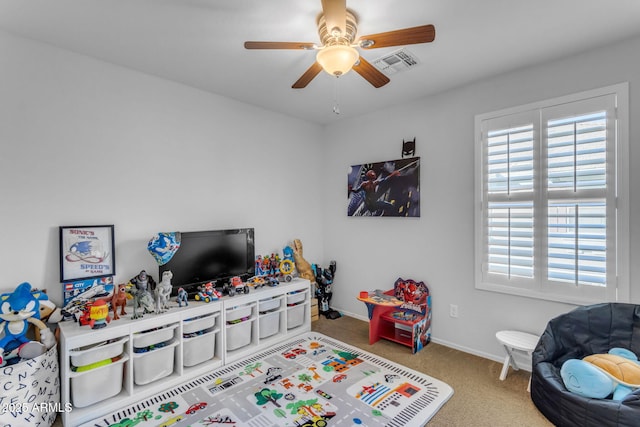 recreation room with carpet flooring and ceiling fan