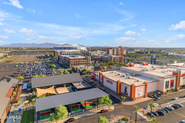 birds eye view of property with a mountain view