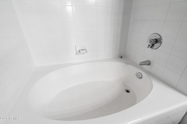 full bathroom featuring a tub to relax in