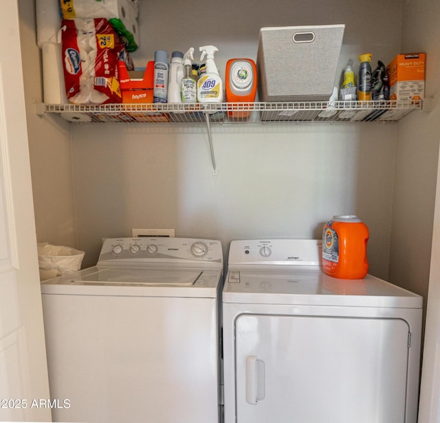 washroom featuring laundry area and washing machine and dryer