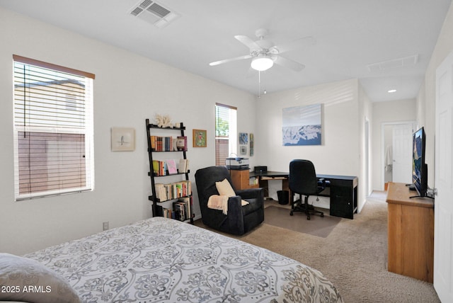 bedroom with visible vents and carpet