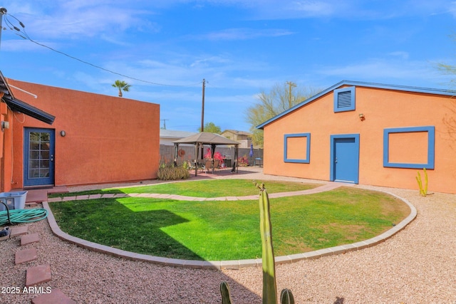 view of yard featuring a gazebo, fence, and a patio