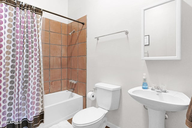 bathroom featuring shower / bath combination with curtain and toilet