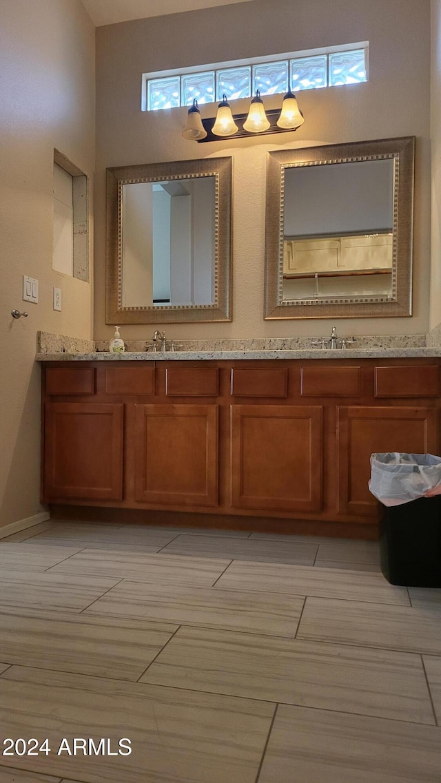 bathroom featuring vanity and a towering ceiling