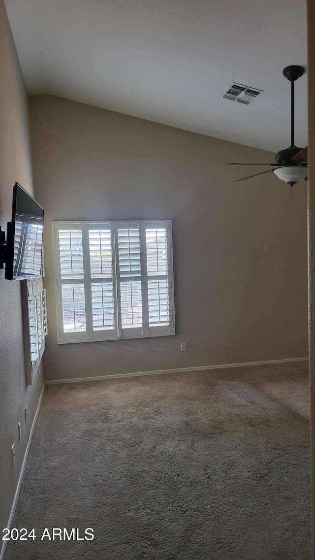 3347 W Steinbeck Dr, Anthem, AZ 85086 - carpeted empty room featuring vaulted ceiling, visible vents, ceiling fan, and a wealth of natural light