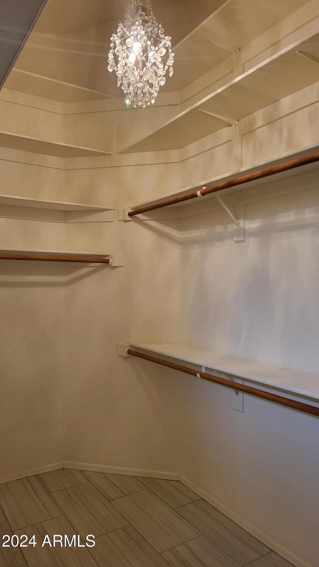 3347 W Steinbeck Dr, Anthem, AZ 85086 - walk in closet featuring a chandelier
