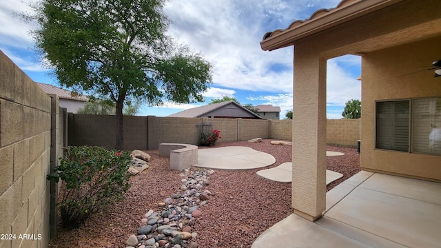 view of yard with a patio area and ceiling fan