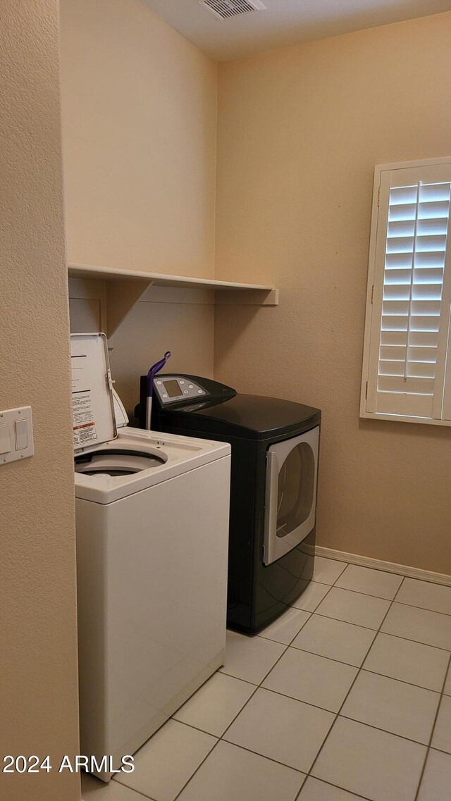 3347 W Steinbeck Dr, Anthem, AZ 85086 - laundry room featuring visible vents, light tile patterned floors, washer and dryer, and laundry area