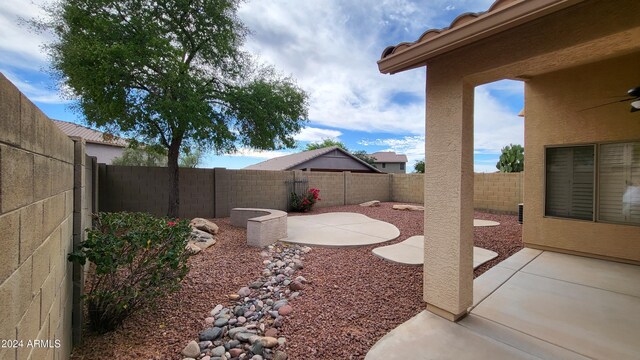 3347 W Steinbeck Dr, Anthem, AZ 85086 - view of yard with a ceiling fan, a patio area, and a fenced backyard