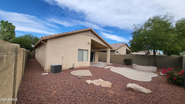 3347 W Steinbeck Dr, Anthem, AZ 85086 - rear view of property with a patio, ceiling fan, a fenced backyard, a tiled roof, and stucco siding