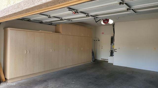 3347 W Steinbeck Dr, Anthem, AZ 85086 - garage featuring a garage door opener and water heater