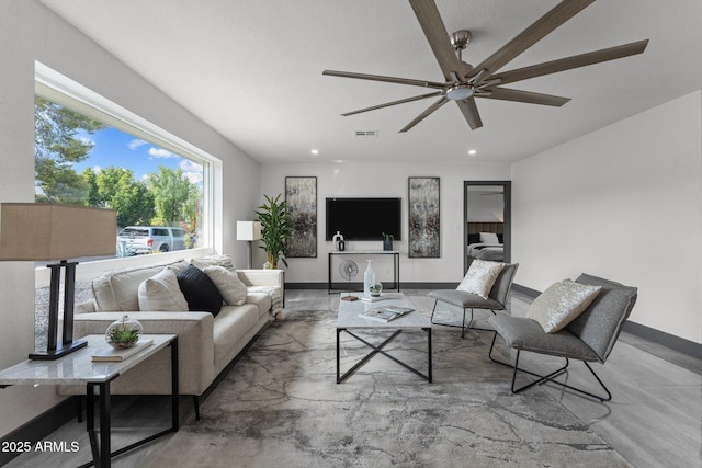 living room featuring visible vents, recessed lighting, a ceiling fan, and baseboards