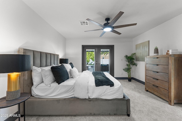 bedroom featuring visible vents, ceiling fan, light colored carpet, french doors, and access to outside