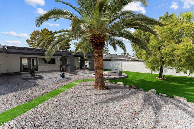 view of yard featuring a patio area and fence