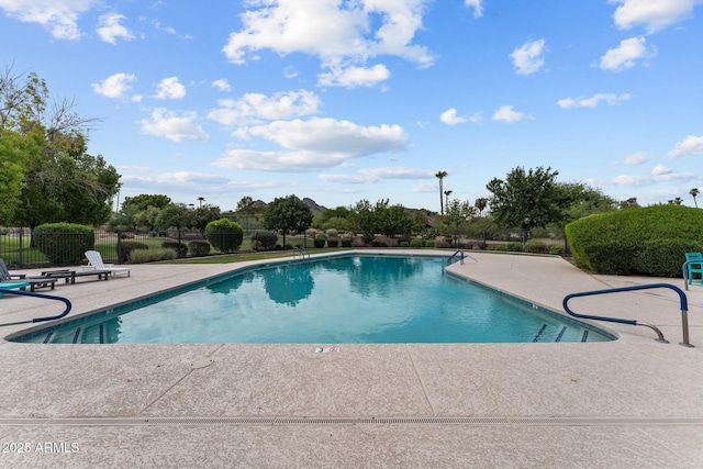 pool featuring a patio and fence