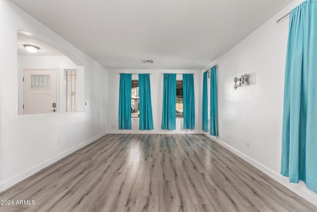 unfurnished room with light hardwood / wood-style floors