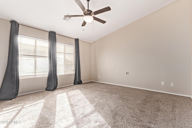 unfurnished room with ceiling fan and light colored carpet